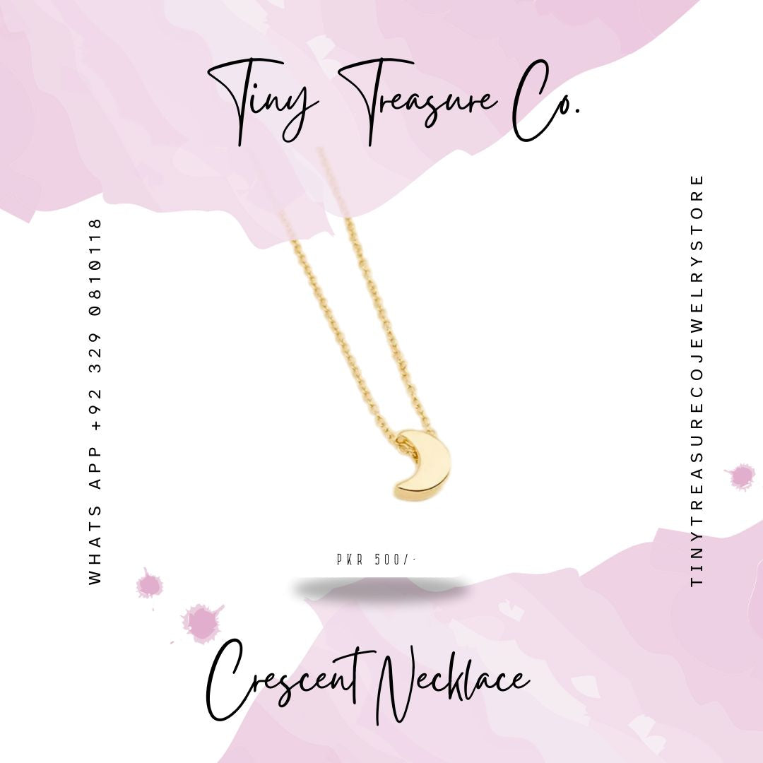 Gold crescent necklace on a pink background with 'Tiny Treasure Co.' branding. Buy the latest variety of kids jewelry online in Pakistan including necklaces, bangles, jewelry sets, rings & other hair ornaments. Shop Now!