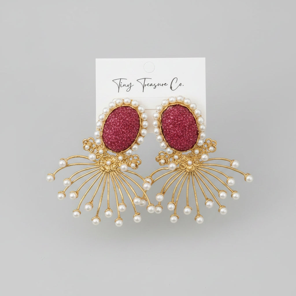Gold and red earrings with pearl accents on a 'Tiny Treasure Co.' card.