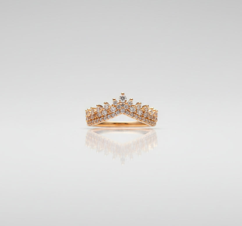 Gold ring on a black surface with a blurred background