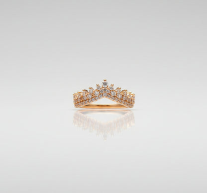 Gold ring on a black surface with a blurred background