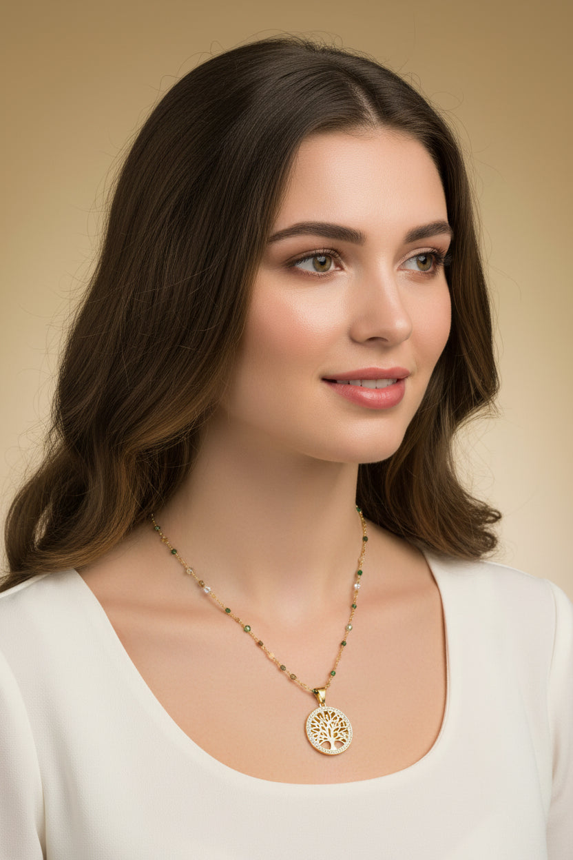 Gold necklace with a decorative pendant on a dark fabric background